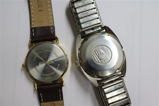 A gentlemans steel Omega Constellation wrist watch and two other watches.